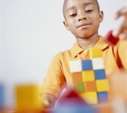 Boy Playing with Math Manipulatives